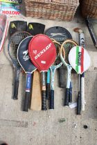 AN ASSORTMENT OF SPORTS ITEMS TO INCLUDE TENNIS RACKETS, A CRICKET BAT AND A HOCKEY STICK ETC