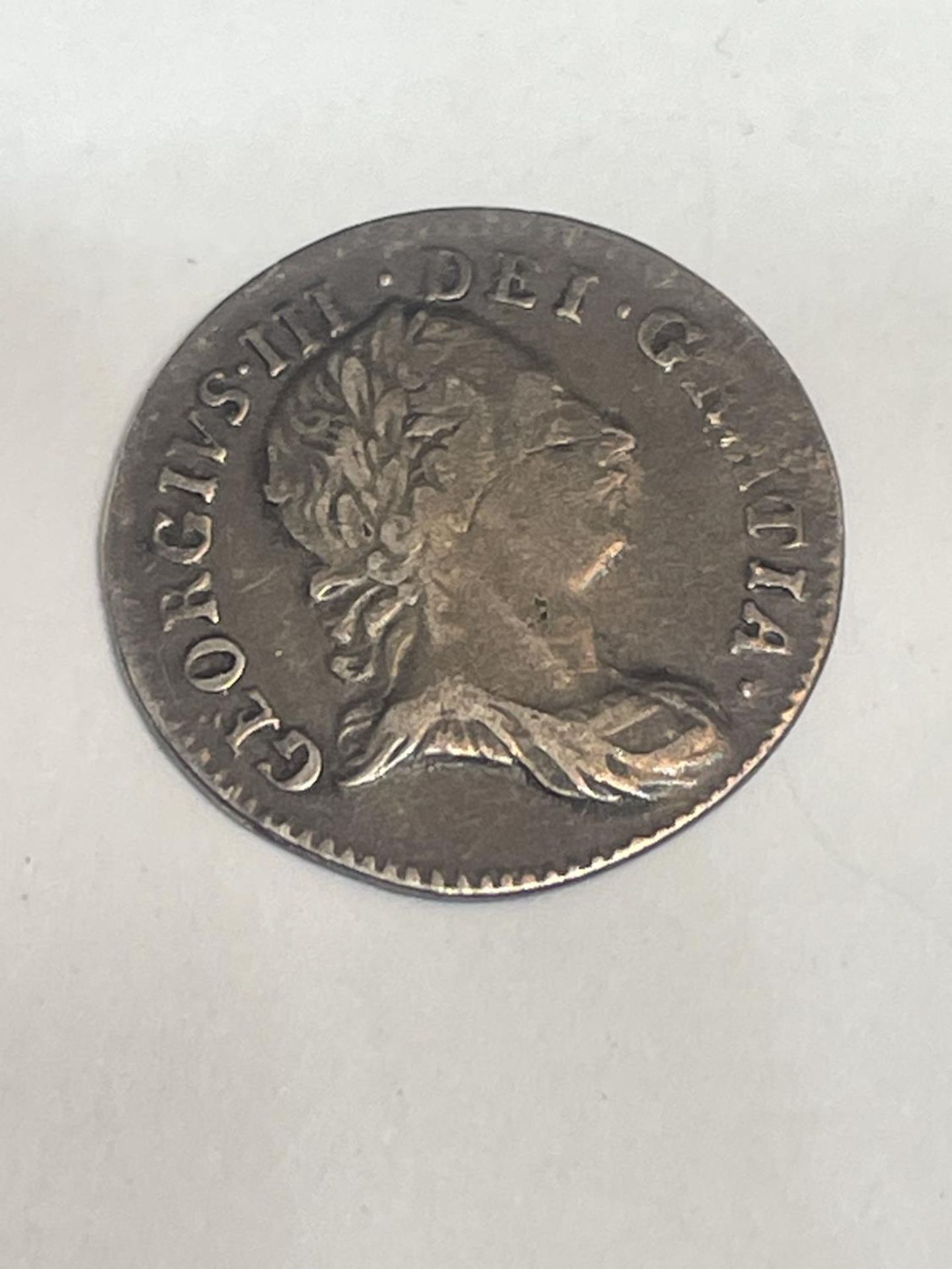 A 1762 GEORGE III SILVER THREE PENCE