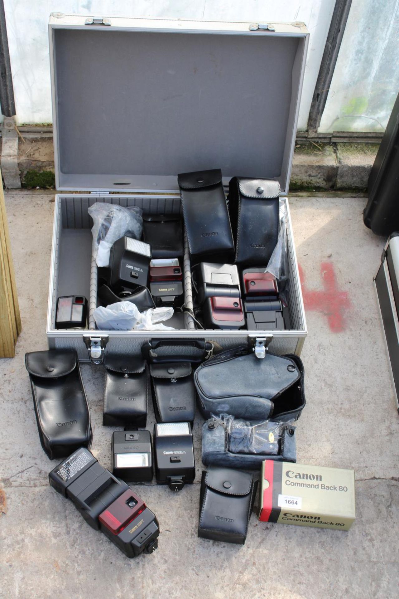 AN ASSORTMENT OF VARIOUS CANON CAMERA FLASHES