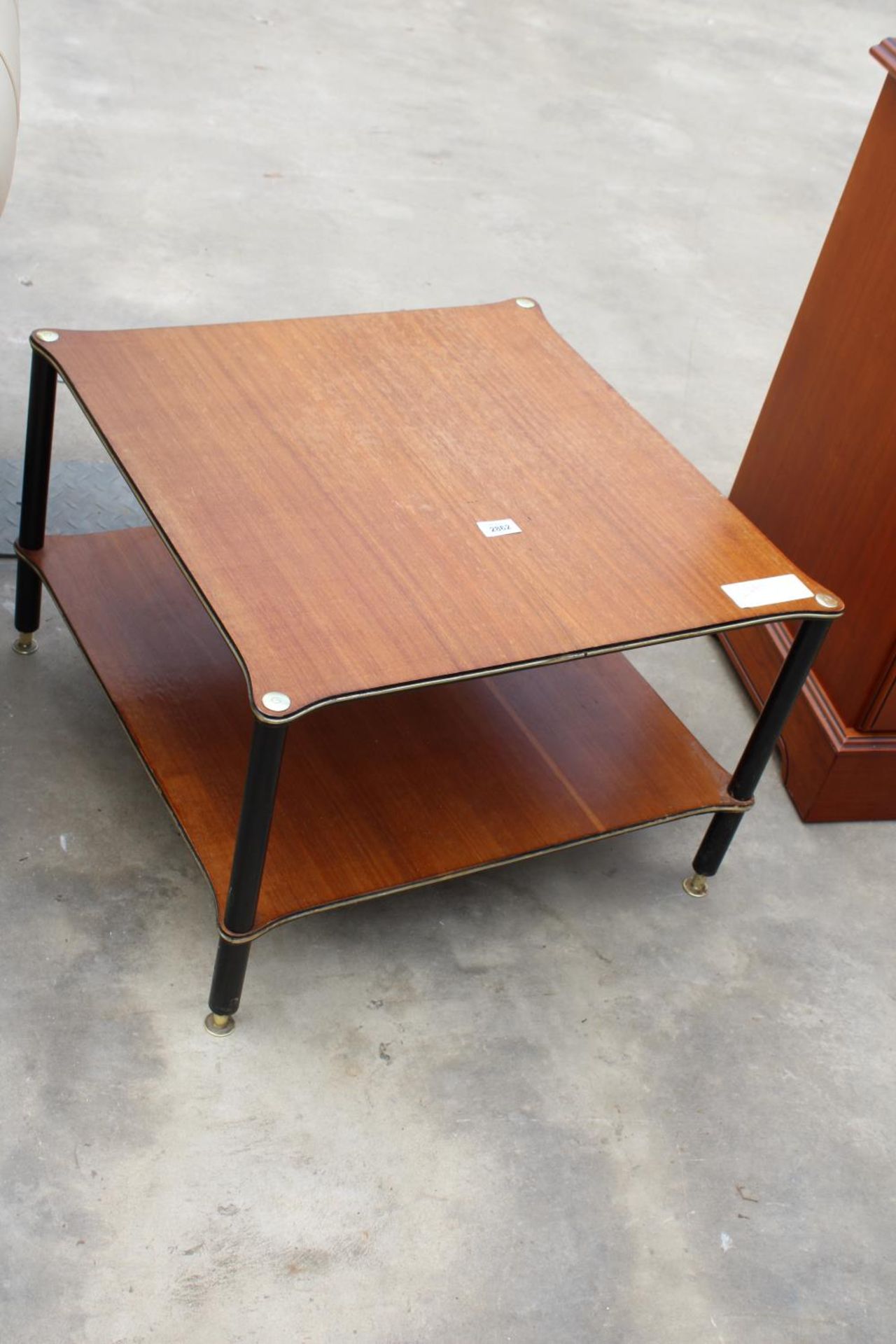 A RETRO TEAK TWO TIER COFFEE TABLE ON BLACK LEGS, 24" SQUARE