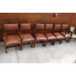 A SET OF 6 OAK JACOBEAN STYLE DINING CHAIRS WITH LEATHER SEATS AND LEATHER STUDDED BACKS ON TURNED