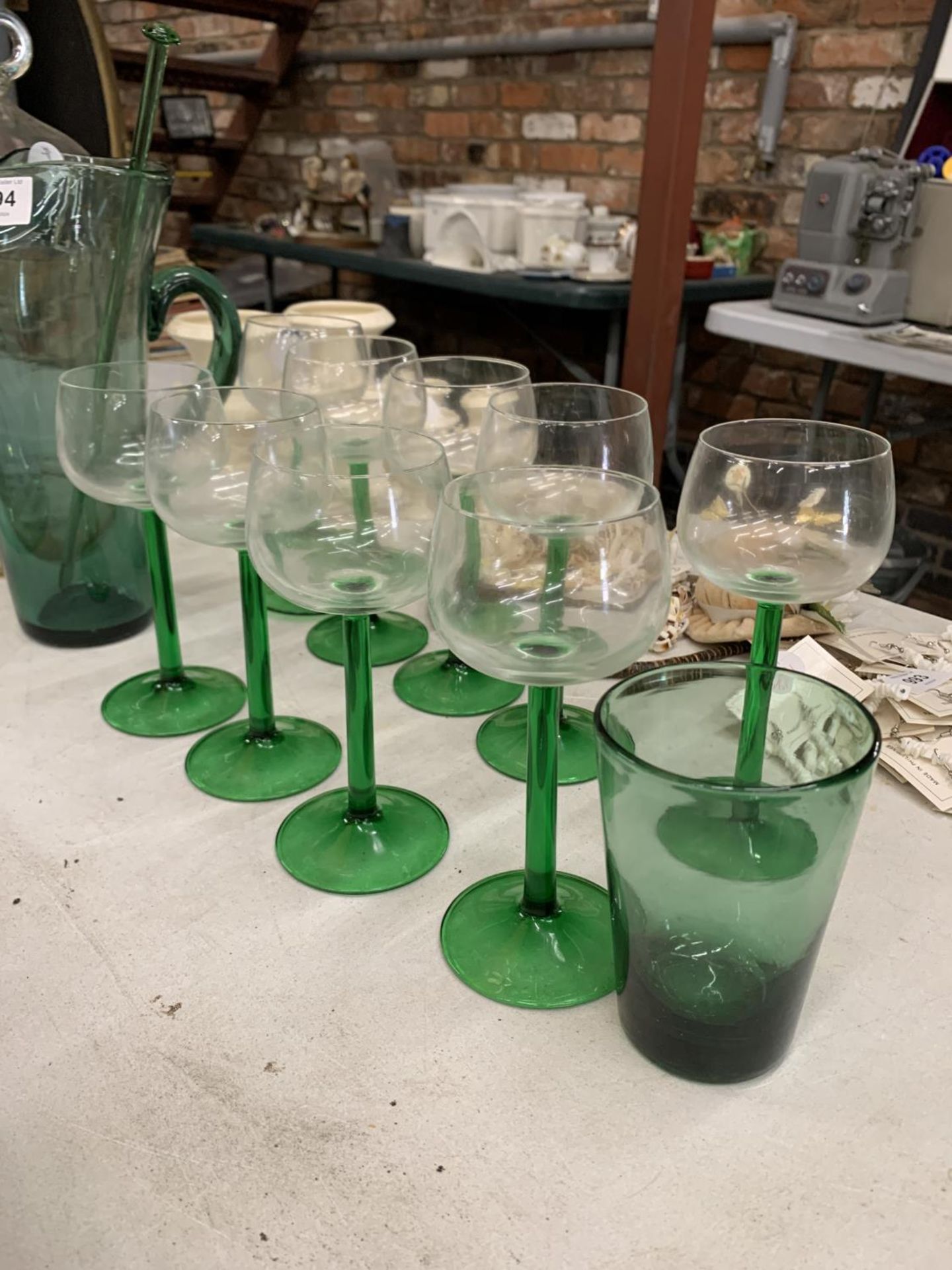 A GREEN LEMONADE JUG WITH GLASS SWIZZLE STICK, NINE WINE GLASSES AND A DEMI-JOHN - Image 3 of 3