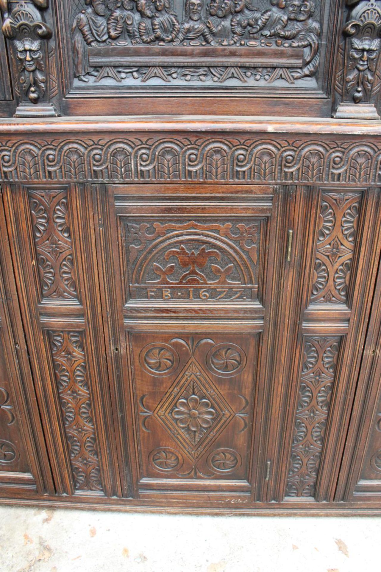 AN OAK GEORGE III STYLE COURT CUPBOARD WITH CARVED PANELS, THREE DEPICTING THE BIRTH AND - Image 8 of 13