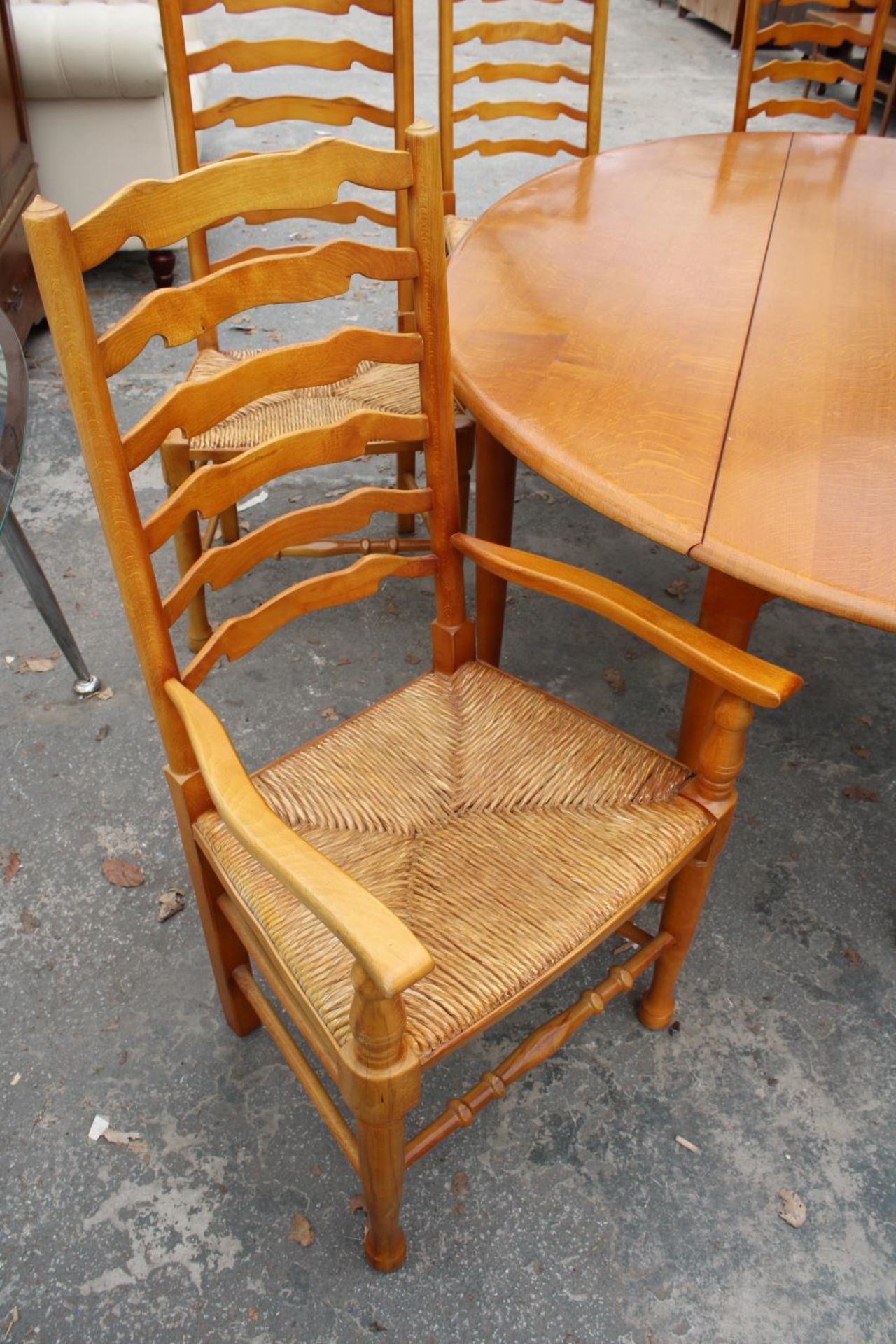 A GEORGIAN STYLE OVAL OAK WAKES TABLE, 77" X 59" OPENED AND SIX LADDER BACK DINING CHAIRS WITH - Image 6 of 9