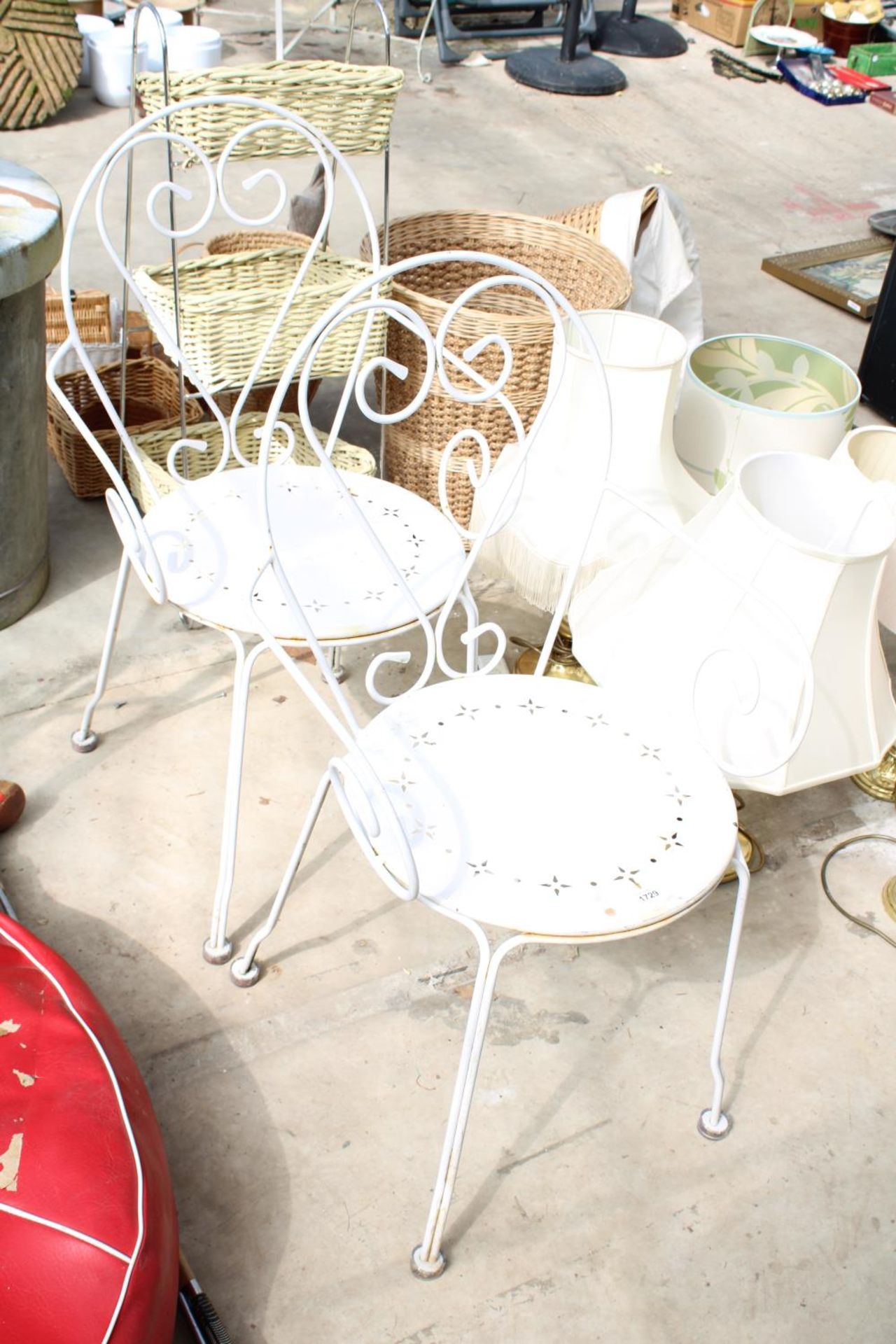 A PAIR OF DECORATIVE METAL BISTRO CHAIRS