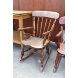 A VICTORIAN STYLE ELM AND BEECH CHILDS ROCKING CHAIR STAMPED R.H. & J. SIMPSON (MAKERS)
