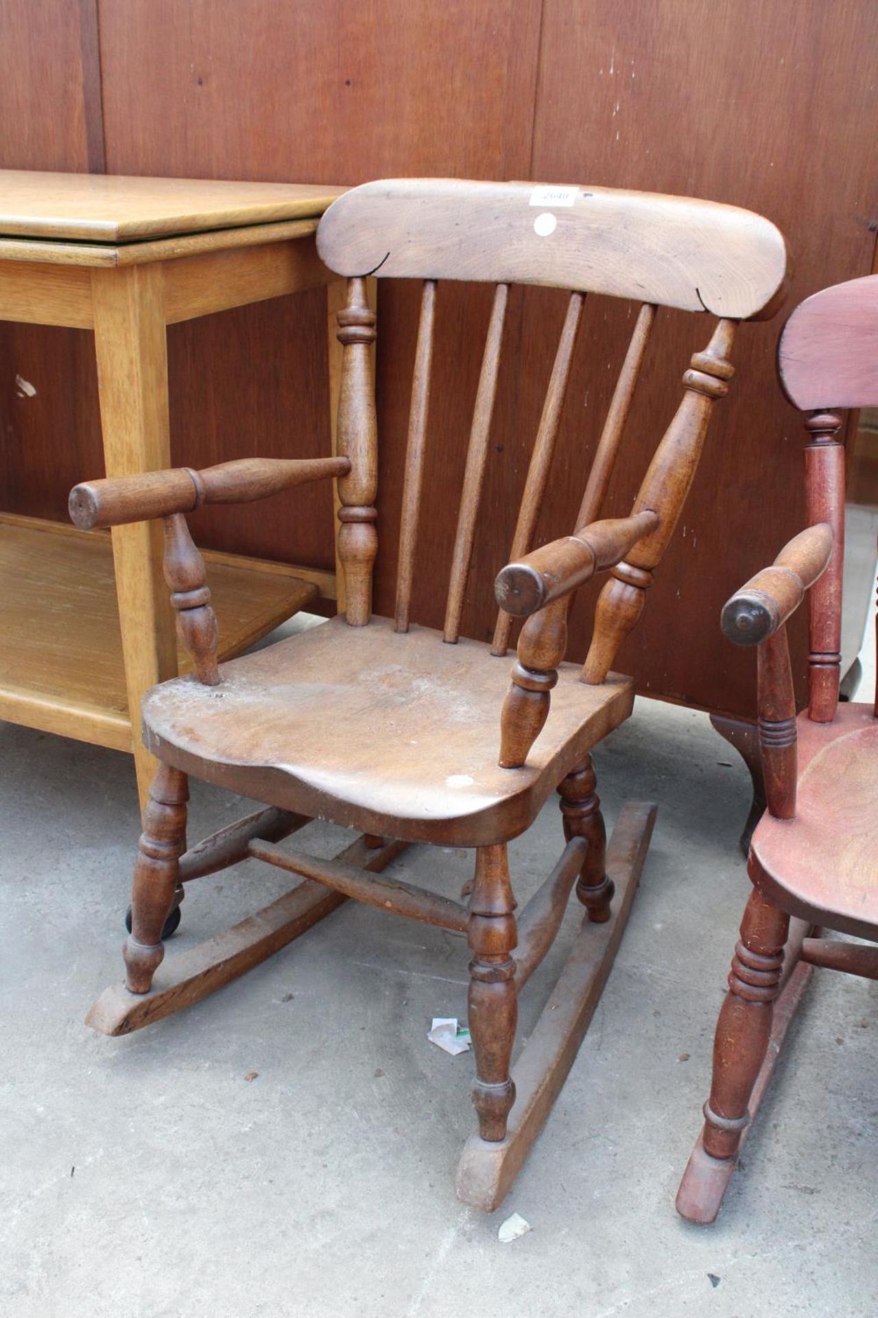 A VICTORIAN STYLE ELM AND BEECH CHILDS ROCKING CHAIR STAMPED R.H. & J. SIMPSON (MAKERS)