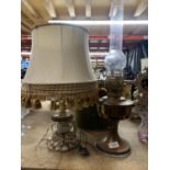 A VINTAGE BRASS OIL LAMP PLUS A FURTHER TABLE LAMP WITH TWO SHADES