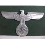 A LARGE ALUMINIUM EAGLE AND SWASTIKA PLAQUE, WIDTH 38CM, HEIGHT 24.5CM