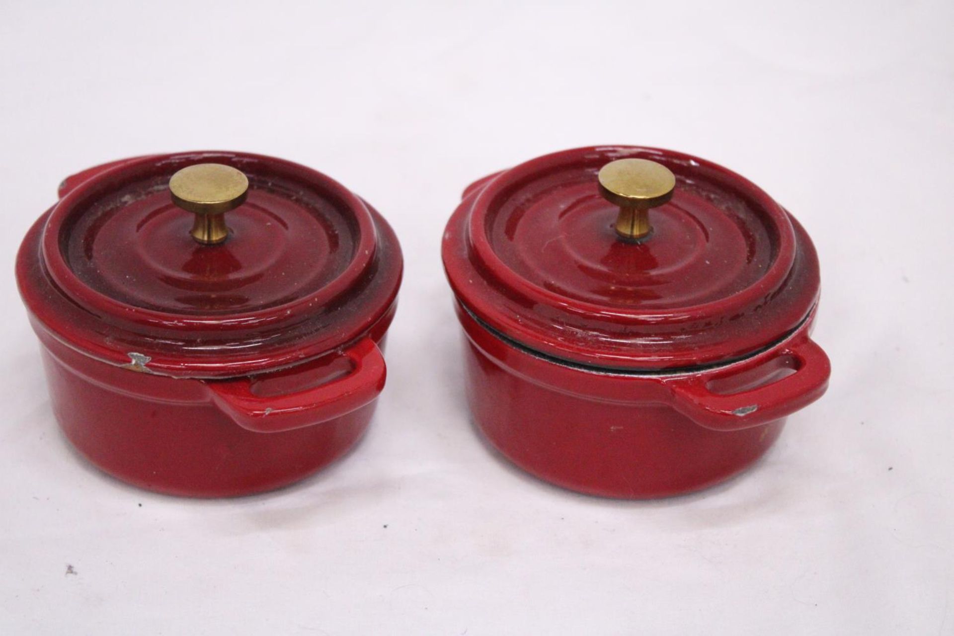 TWO MINI CAST IRON LIDDED COOKING POTS