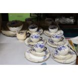 A VINTAGE CHINA TEASET SET, WITH BLUE AND WHITE PATTERN AND FLUTED EDGES, TO INCLUDE CAKE PLATES,