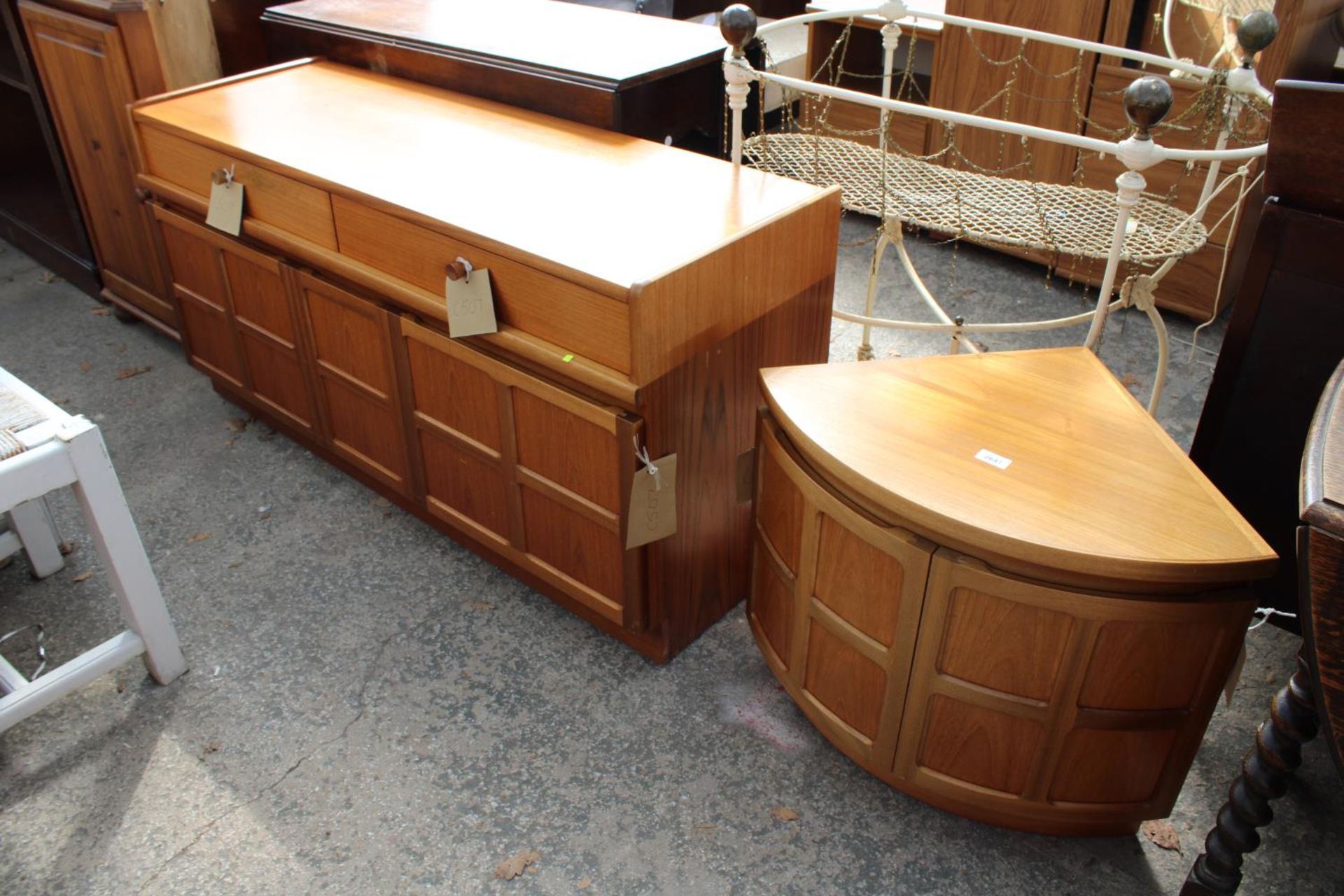 A RETRO TEAK NATHAN SIDEBOARD ENCLOSING 2 DRAWERS AND 3 CUPBOARDS, 51" WIDE AND CORNER RETURN