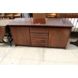 A RETRO HARDWOOD SIDEBOARD ENCLOSING 4 DRAWERS, 2 CUPBOARDS, 63" WIDE