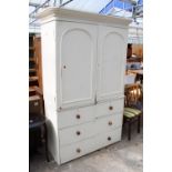 A VICTORIAN HOUSEMAIDS CUPBOARD, WHITE PAINTED OVER SCUMBLE WITH 2 SHORT AND 2 LONG DRAWERS TO BASE,