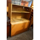 A MODERN OAK 2 DOOR GLAZED BOOKCASE ON BASE, 41.5" WIDE