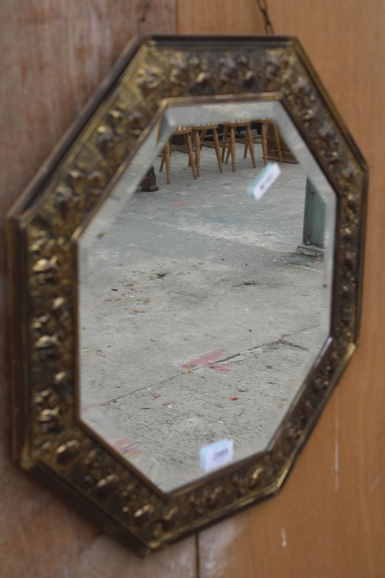 AN OCTAGONAL EMBOSSED BRASS BEVEL EDGE WALL MIRROR - Image 2 of 2