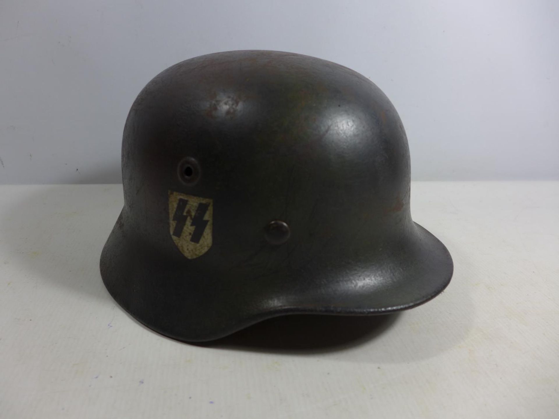 A MID 20TH CENTURY GERMAN PAINTED METAL HELMET