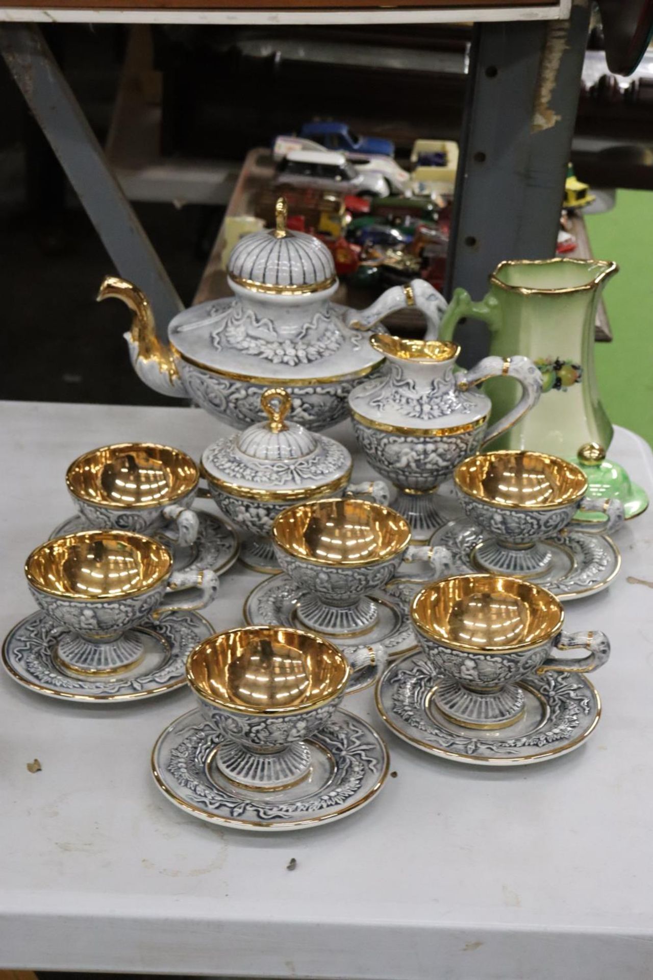 A R.CAPODIMONTE COFFEE SERVICE TO INCLUDE SIX CUPS AND SAUCERS, LARGE COFFEE POT, JUG AND SUGAR BOWL