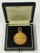 A HALLMARKED 9 CARAT GOLD FOOTBALL LEAGUE DIVISION 3 NORTHERN SECTION LEAGUE WINNERS MEDAL 1953-1954