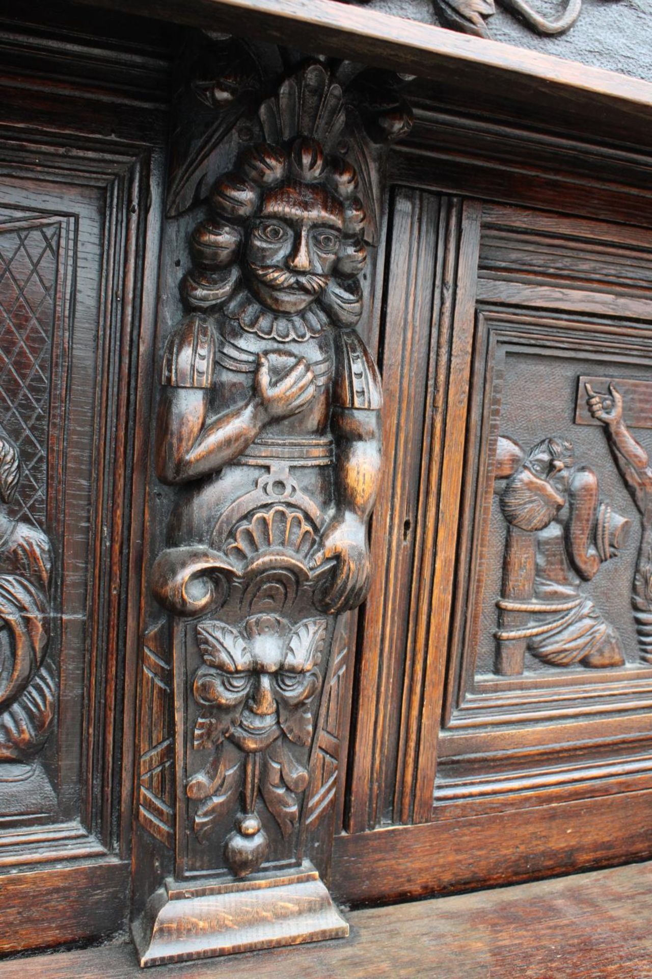 AN OAK GEORGE III STYLE COURT CUPBOARD WITH CARVED PANELS, THREE DEPICTING THE BIRTH AND - Image 11 of 13