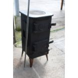 A VINTAGE CAST IRON STOVE