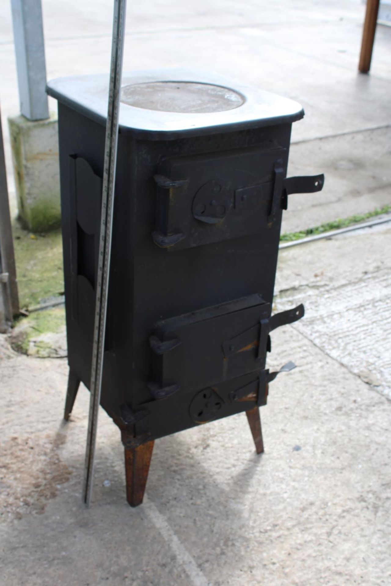 A VINTAGE CAST IRON STOVE