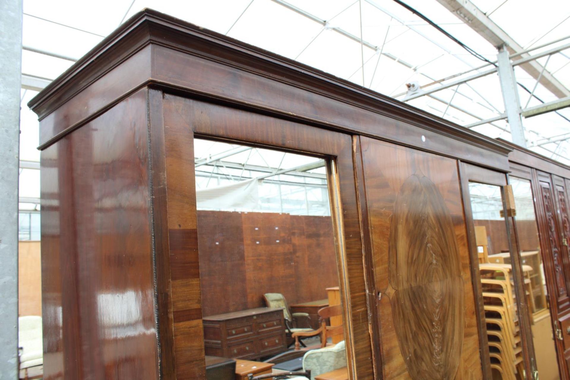 AN EDWARDIAN MAHOGANY DOUBLE MIRROR-DOOR WARDROBE ENCLOSING CUPBOARDS AND FOUR GRADUATED DRAWERS, - Image 4 of 4