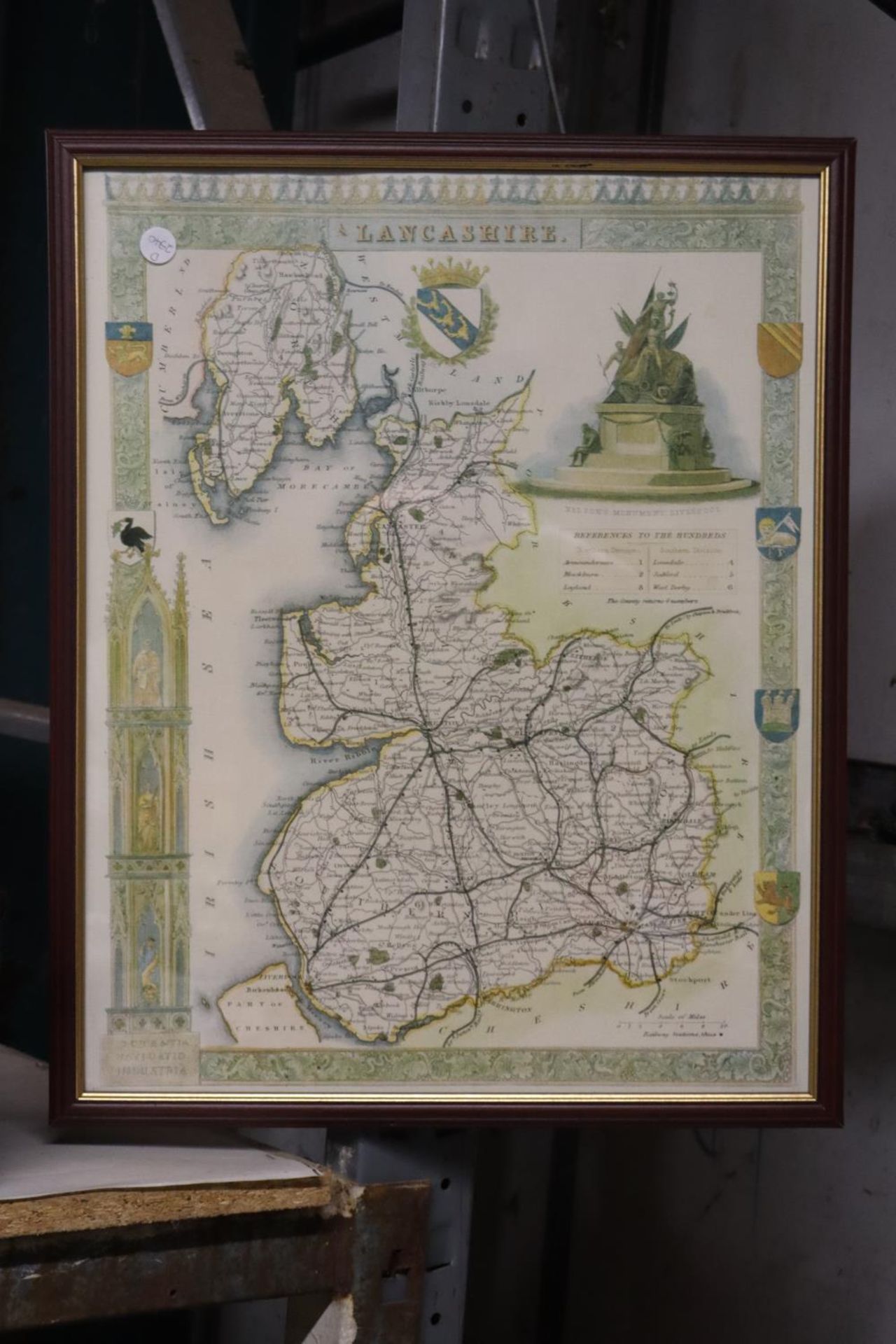 A FRAMED PRINT OF A MAP OF LANCASHIRE