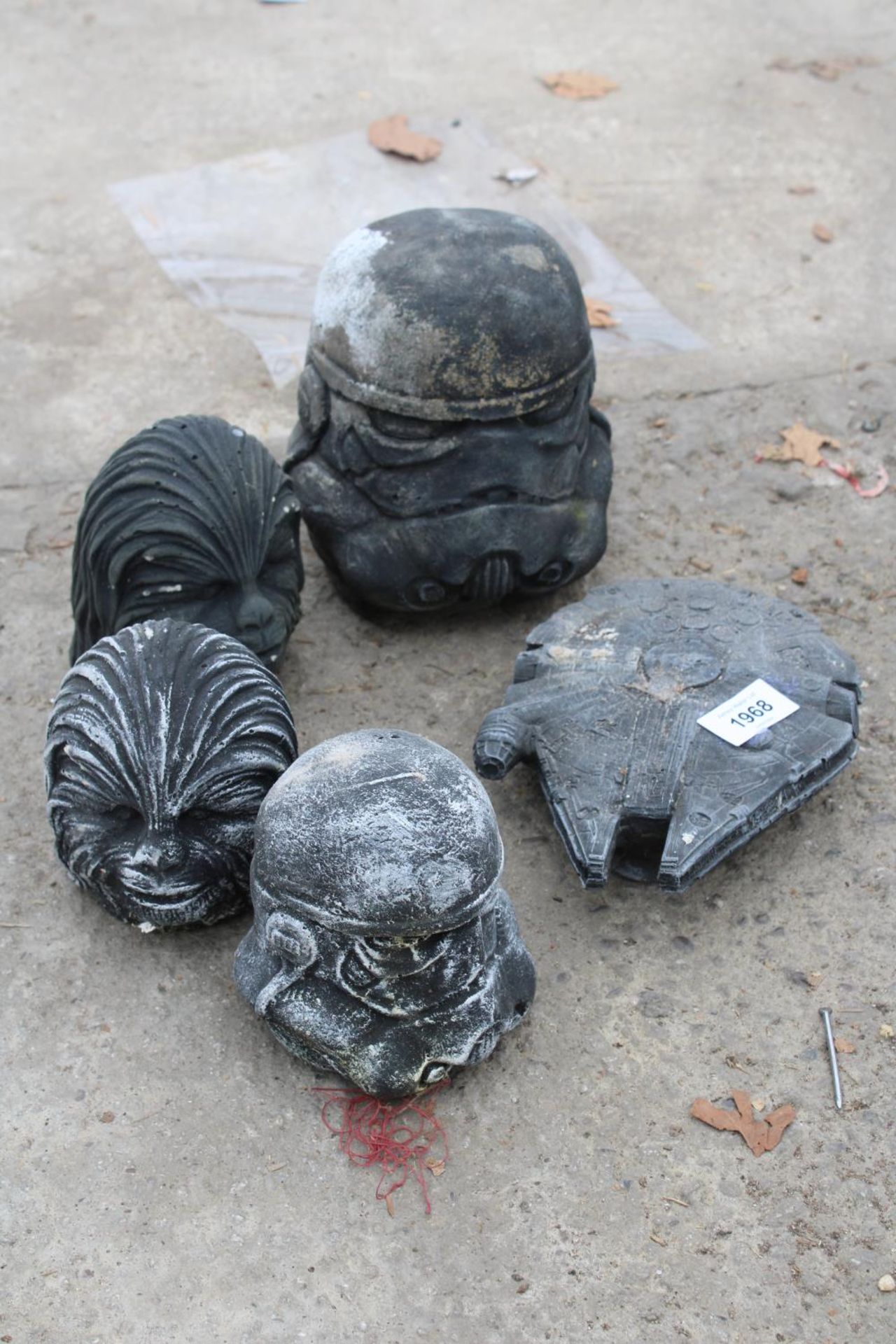 FIVE CONCRETE GARDEN FIGURES TO INCLUDE DARTH VADER AND A STARSHIP ENTERPRISE ETC