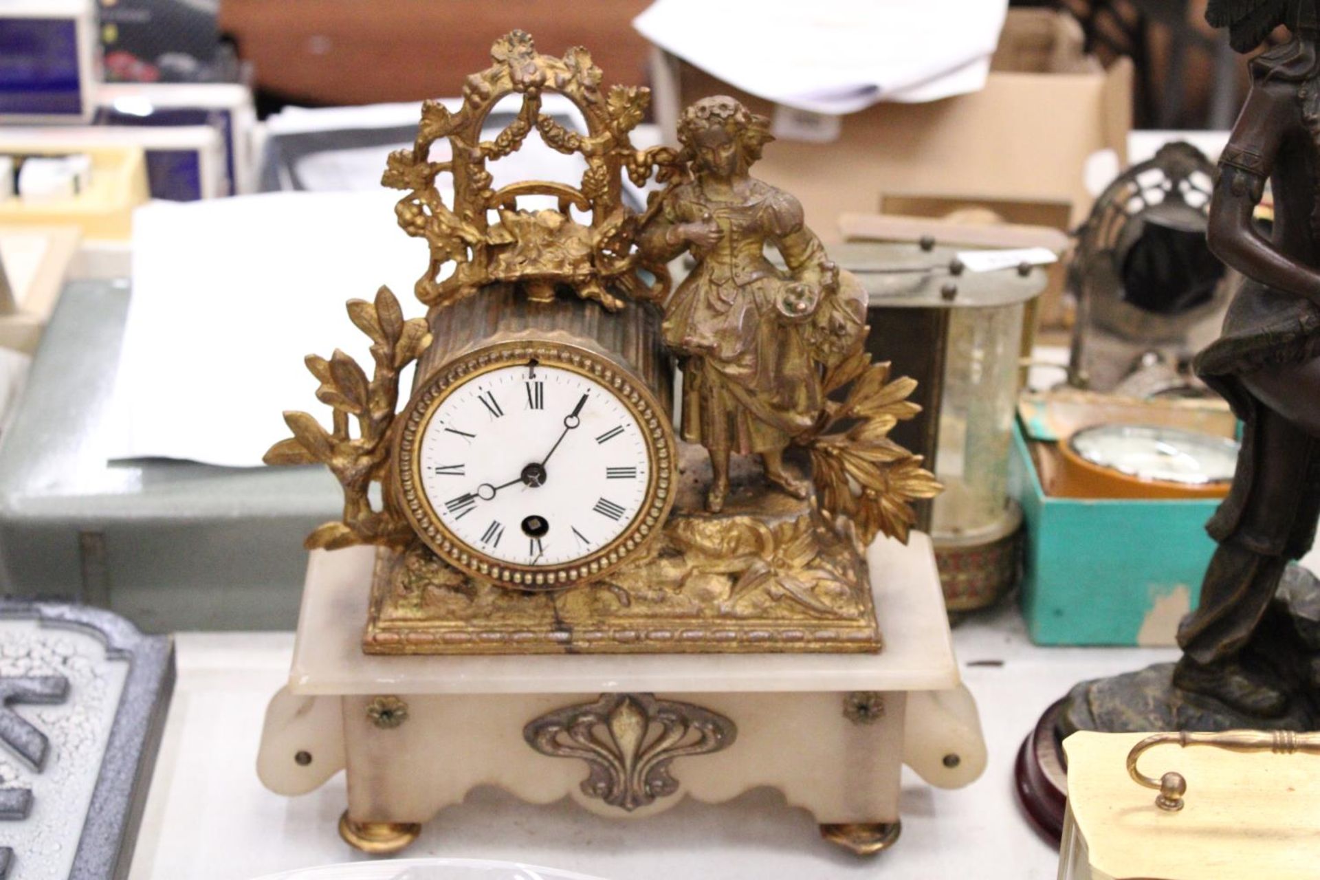 A LATE 19TH CENTURY, FRENCH, GILT MANTLE CLOCK, WITH FIGURE DESIGN