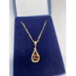 A 9 CARAT GOLD AND RUBY NECKLACE