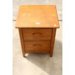 A MODERN OAK BEDSIDE CHEST