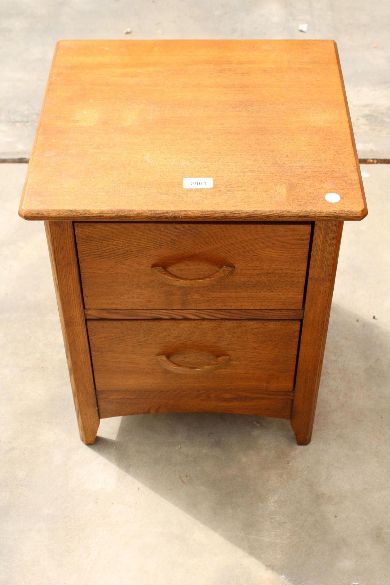 A MODERN OAK BEDSIDE CHEST