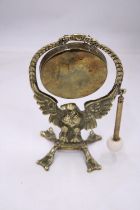 AN ANTIQUE BRASS EAGLE DINNER GONG WITH ORIGINAL STRICKER