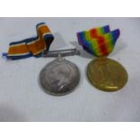 A WORLD WAR I MEDAL PAIR AWARDED TO S-14391 PRIVATE J DAVIDSON SEAFORTH HIGHLANDERS
