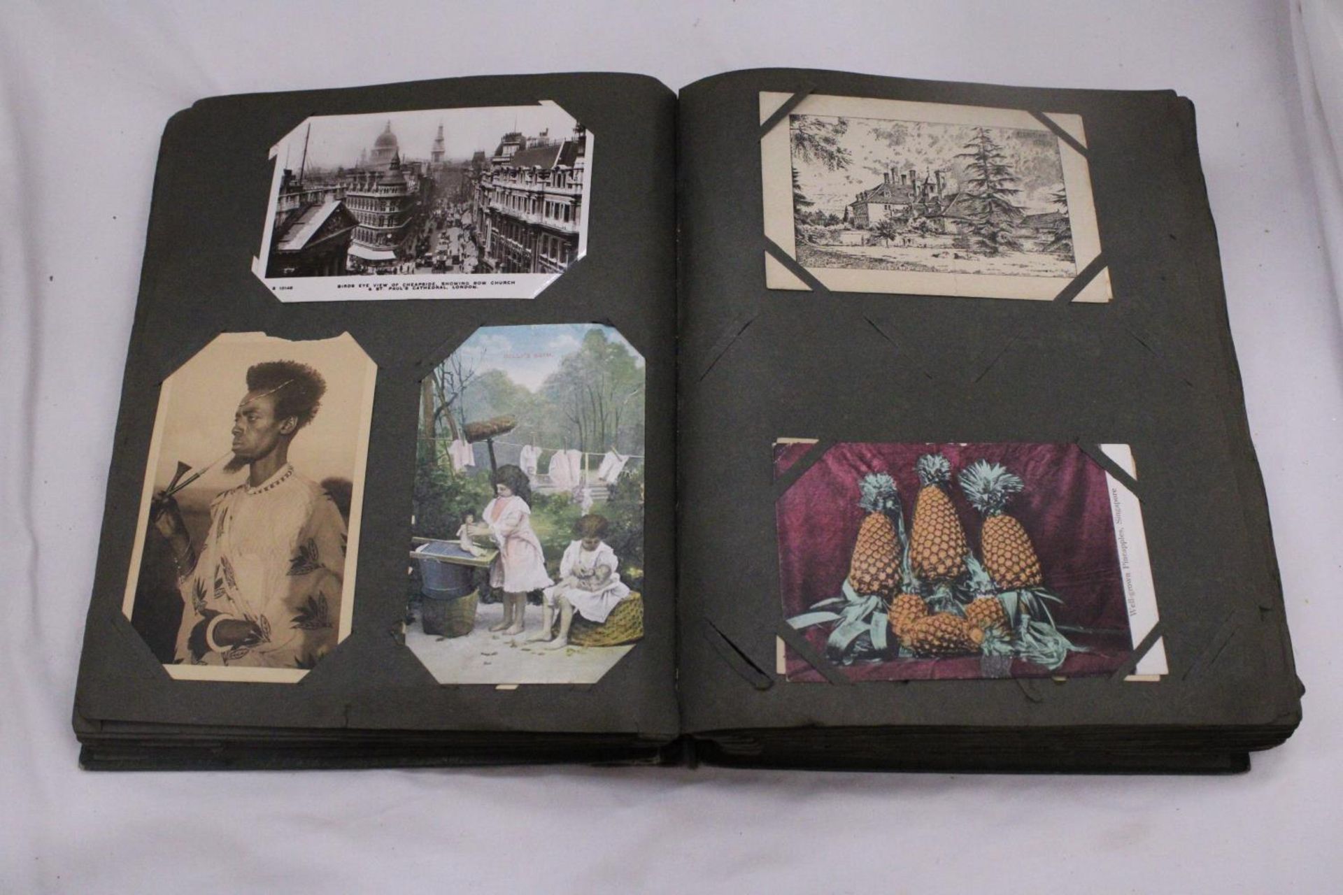 A LATE VICTORIAN POSTCARD ALBUM WITH POSTCARDS - Image 4 of 5