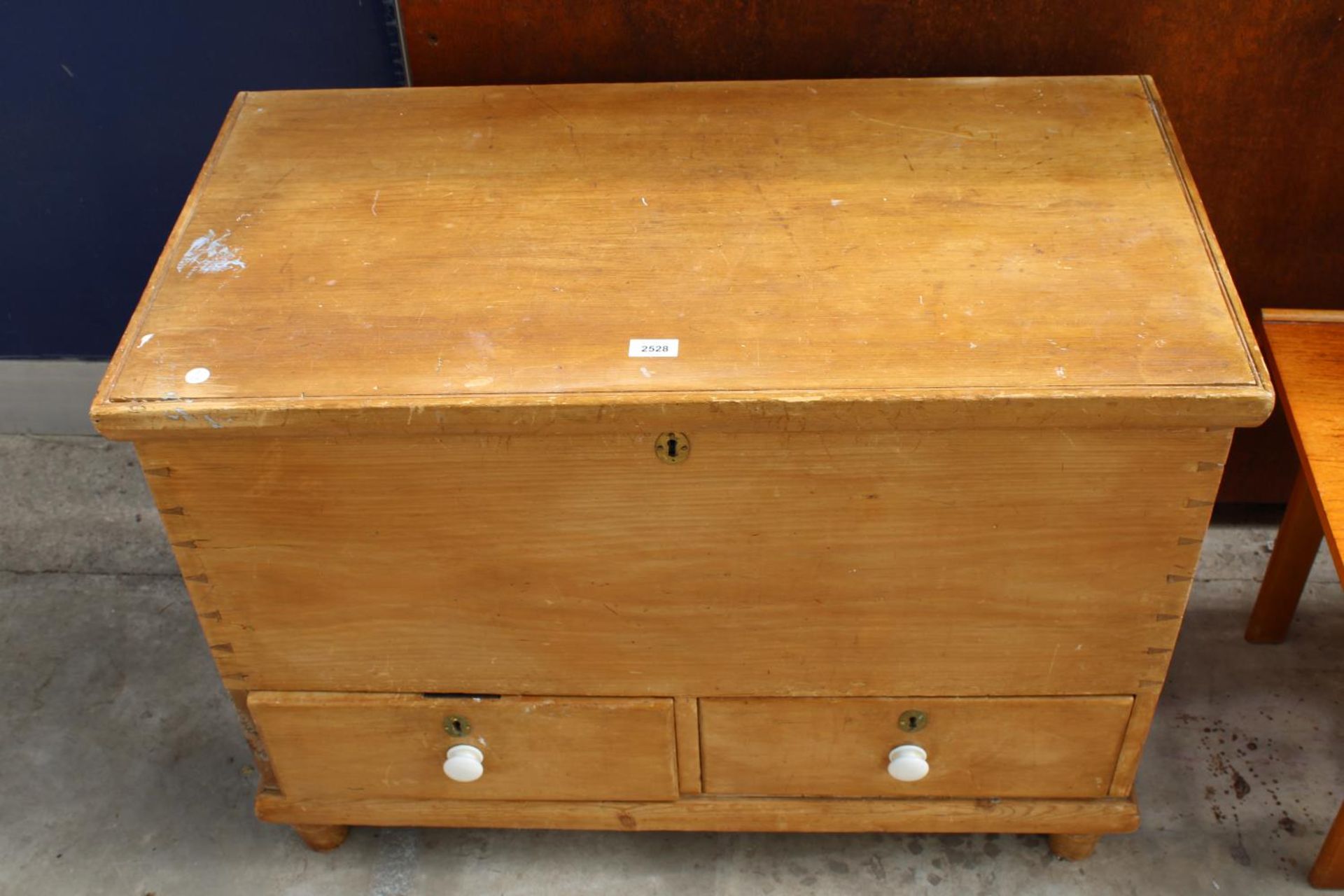 A VICTORIAN PINE BLANKET CHEST WITH 2 DRAWERS TO BASE AND IRON CARRYING HANDLES, 36" WIDE