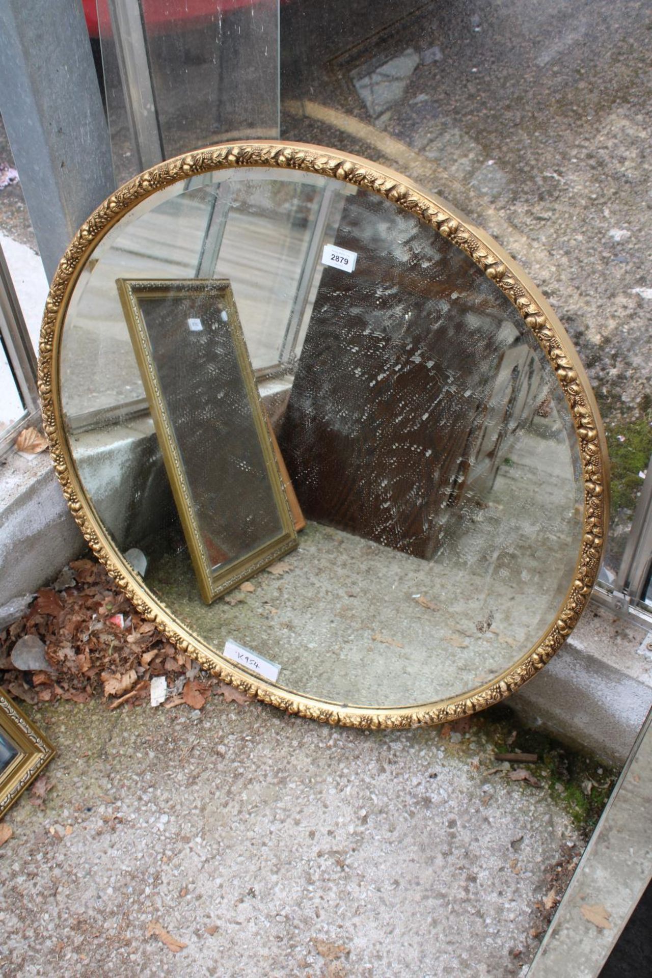 A MODERN 32" DIAMETER GILT FRAMED WALL MIRROR