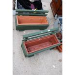 TWO WOODEN TROUGH PLANTERS WITH PLASTIC LINERS