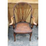 A MODERN WINDSOR STYLE ELBOW CHAIR WITH PIERCED SPLAT BACK ON CABRIOLE LEGS WITH CRINOLINE ROW.