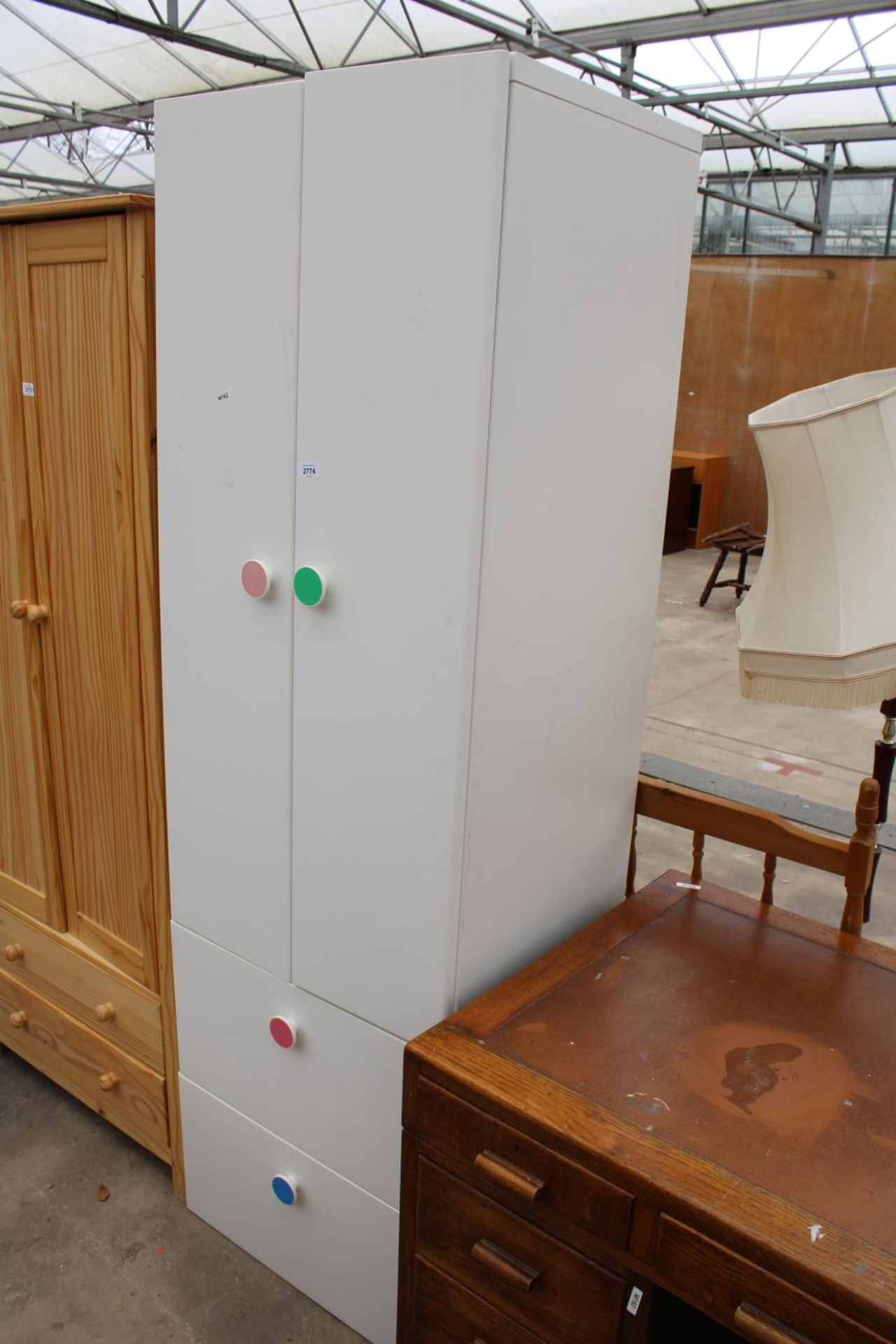 A MODERN WHITE TWO DRAWER WARDROBE WITH TWO DRAWERS TO BASE, 23" WIDE