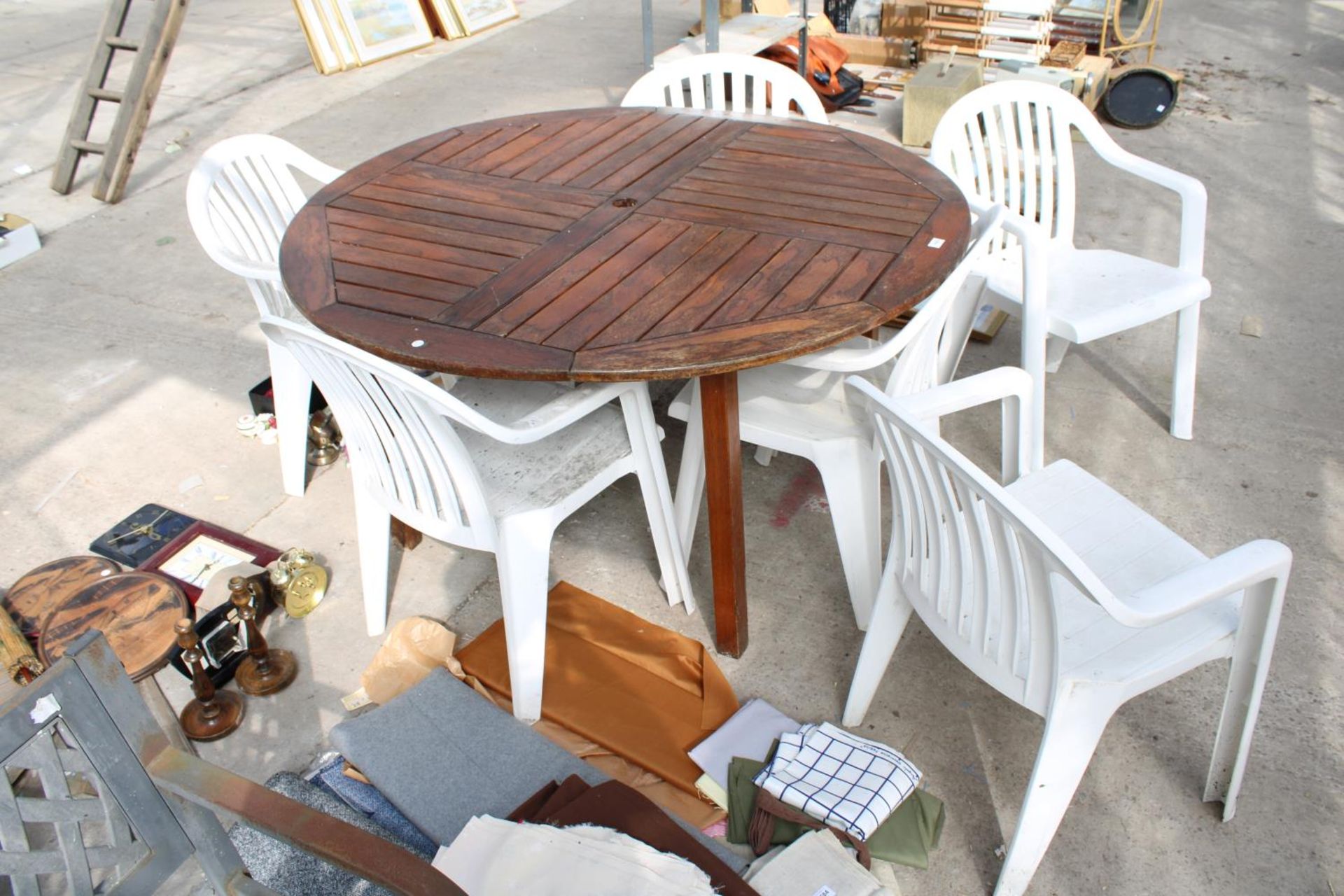 A TEAK GARDEN TABLE WITH SIX PLASTIC STACKING CHAIRS - Image 2 of 3