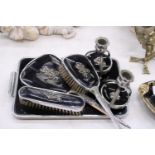 A VINTAGE BLACK DRESSING TABLE VANITY SET TO INCLUDE A HAND MIRROR, TWO BRUSHES AND TRAY - PLUS