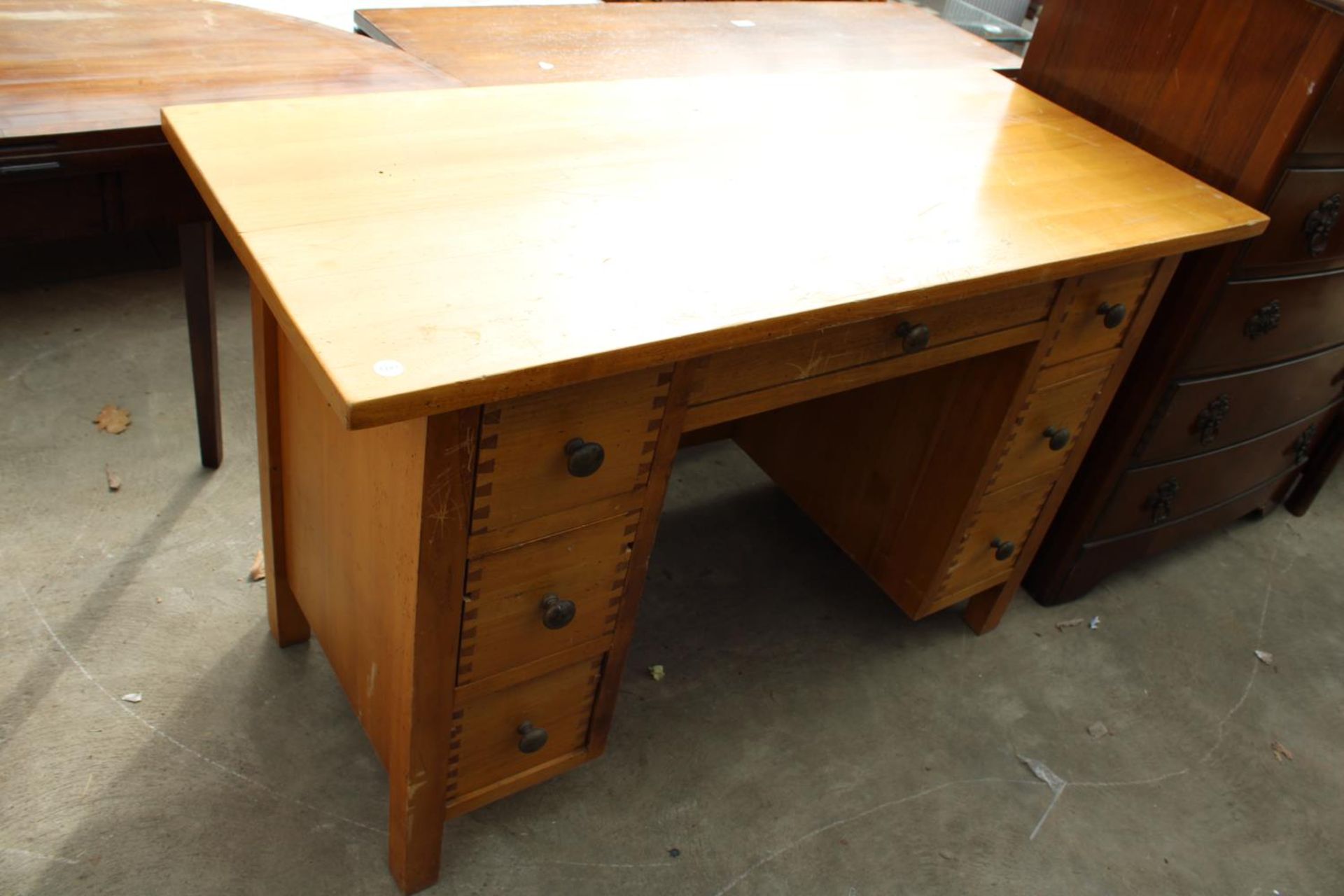 A MODERN HARDWOOD TWIN-PEDESTAL DESK WITH BRASS KNOBS, 47" X 20"