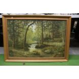A LARGE OIL ON CANVAS OF A WOODLAND RIVER SCENE, IN A GILT FRAME, WITH INDISTINCT SIGNATURE, 103CM X