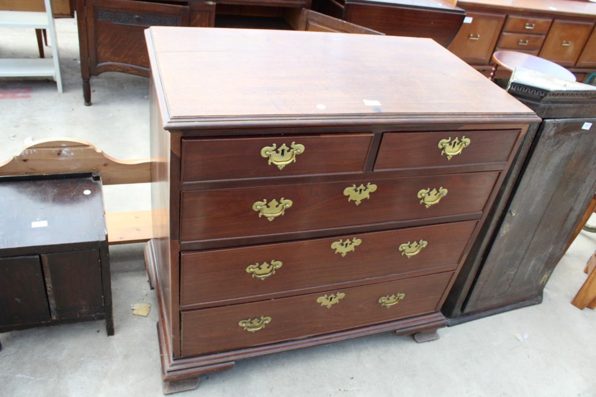 A GEORGE III MAHOGANY CHEST OF 2 SHORT AND 3 LONG GRADUATED DRAWERS ON OGEE FEET, 37" WIDE