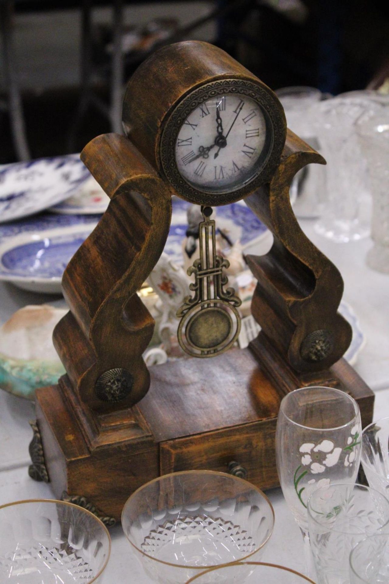 A BATTERY OPERATED WOODEN MANTEL CLOCK WITH DRAW - APPROXAMTLEY 38CM