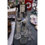 A QUANTITY OF GLASSWARE TO INCLUDE SCENT BOTTLES, A JUG WITH SILVER PLATED TOP, PAPERWEIGHTS, A