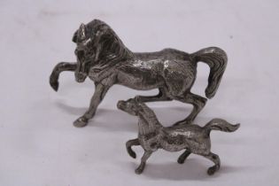 TWO WHITE METAL MODELS OF HORSES