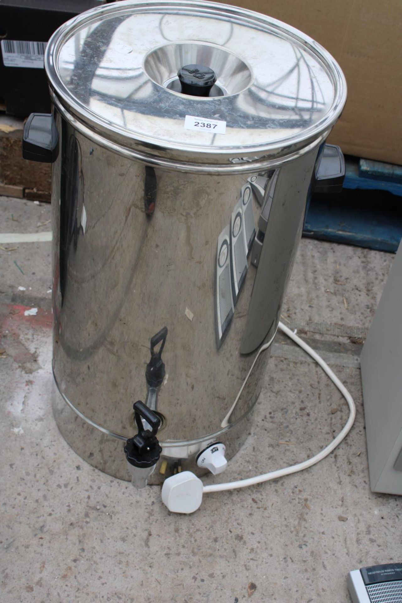 A STAINLESS STEEL TEA URN